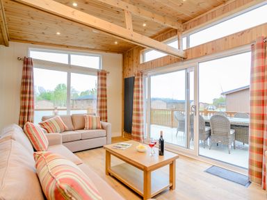 A living room with a sofa and coffee table at The Wansford (Pet) Kings Cliffe