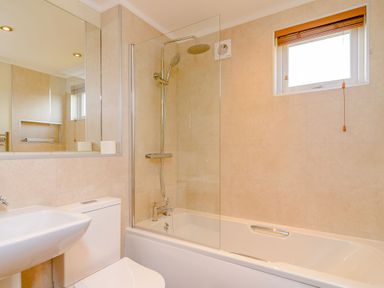 A bathroom with a shower and bathtub at The Alwalton in Kings Cliffe