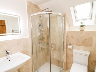 A bathroom with a shower, sink and toilet at Lake View in Crediton