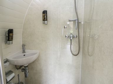 A bathroom with a sink and a shower at Garden Lodge 9 Swansea