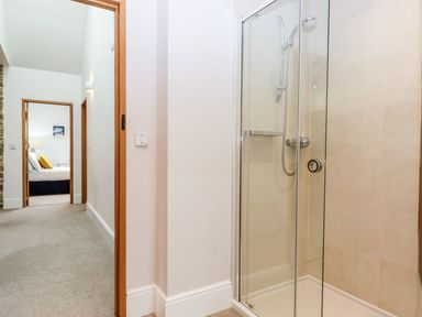 A bathroom with a shower cubicle at Knowle House in Okehampton