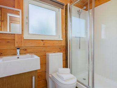 A bathroom with a sink and shower at Yew Tree Spa (Pet) Carlton Miniott near Thirsk