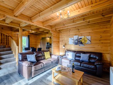 A living room with sofas and a coffee table at Birch Waterside Spa Carlton Miniott near Thirsk