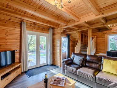 A living room with a sofa and coffee table at Birch Waterside Spa Carlton Miniott near Thirsk