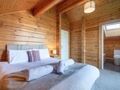 A bedroom with a bed and skylight at Birch Waterside Spa Carlton Miniott near Thirsk