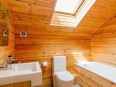 A bathroom with a sink, toilet, and bathtub at Birch Waterside Spa in Carlton Miniott near Thirsk