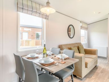 A dining room with a table set for dinner at Cedar Spa Carlton Miniott near Thirsk