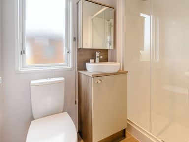 A bathroom with a sink and toilet at Cedar Spa in Carlton Miniott near Thirsk