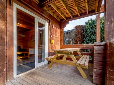 An outdoor area with a picnic table and an entrance at Birch Spa (Pet) Carlton Miniott near Thirsk
