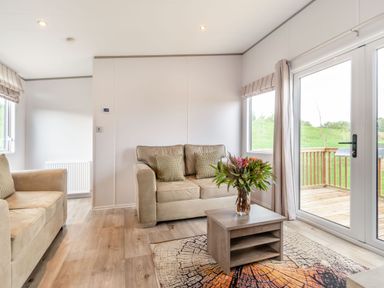 A living room with sofas and a coffee table at Kinder Spa near Carlton Miniott Thirsk