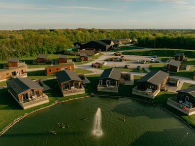 An overview of cabins around a lake at Kinder Spa (Pet) Carlton Miniott near Thirsk