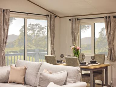 A dining room with a table set for meals at Laurel Spa Carlton Miniott near Thirsk