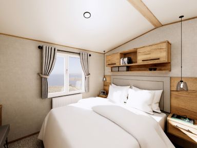 A bedroom with a bed and a window at Willow Spa (Pet) Carlton Miniott near Thirsk