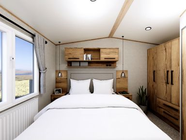 A bedroom with a bed and wardrobe at Willow Spa (Pet) Carlton Miniott near Thirsk