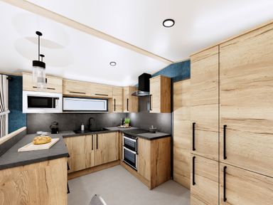 A kitchen with wooden cabinets and modern appliances at Willow Waterside Spa Carlton Miniott near Thirsk