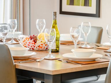 A dining room with a table set for a meal at Oak Waterside Spa (Pet) Carlton Miniott near Thirsk