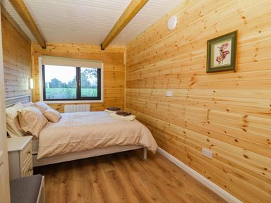 A bedroom with bed and window at Killinure Cottage in Glasson, County Westmeath
