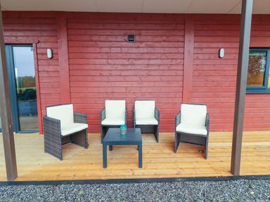 An outdoor lounge area with chairs and a table at Killinure Cottage in Glasson, County Westmeath