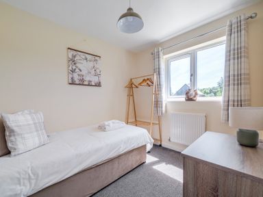 A bedroom with a bed and a window at Aspen Lodge near Brigg