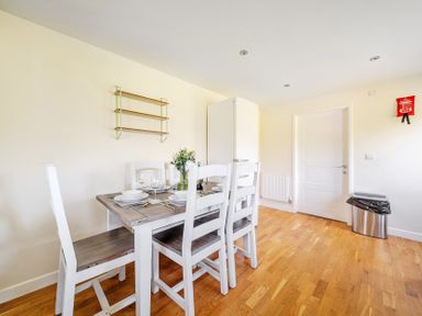 A dining room with a table and chairs at Sage Lodge near Brigg