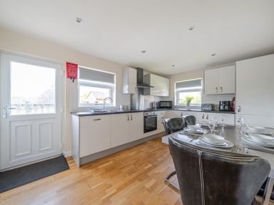 A kitchen with countertop and dining area at Paddington Lodge near Brigg
