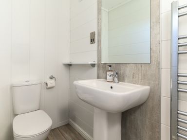 A bathroom with a sink and toilet at Grasmere in Penrith