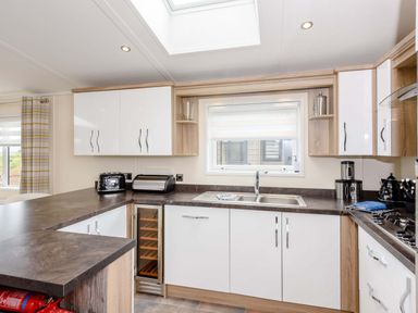 A kitchen with a sink and appliances at Keswick in Penrith