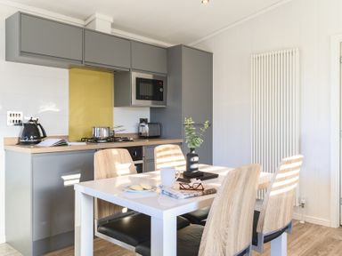 A kitchen with a table and chairs at Grasmere (Pet) Penrith
