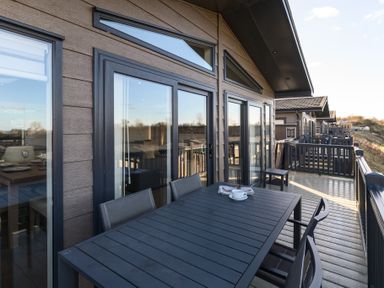 An outdoor area with a table and chairs at Keswick (Pet) Penrith