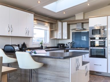A kitchen with modern appliances at Keswick (Pet) Penrith