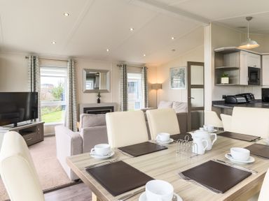 A dining room with a dining table and chairs at Helvellyn (Pet) Penrith
