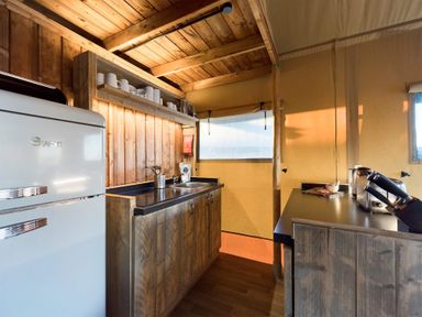 A kitchen with a refrigerator and sink at Kruger in Penrith