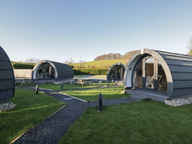 Three glamping pods with outdoor seating at Pod 5 (Pet Friendly) Tewitfield