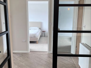 A bedroom with a bed and bedside table at 81 Lon Gogarth in Benllech