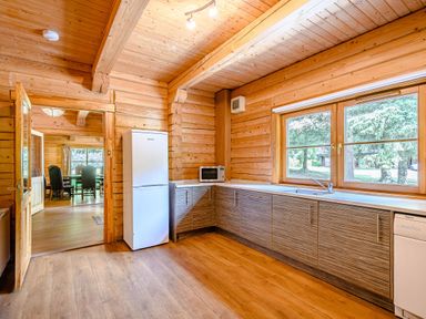 A kitchen with a refrigerator and microwave at Foresters Spa Plus in Dundee