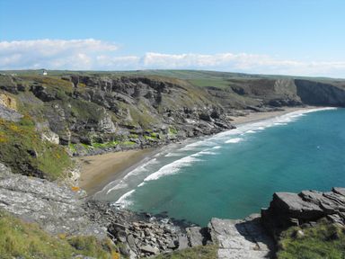A beach with cliffs and ocean view at 65 Benasa Lodge near St Columb Major