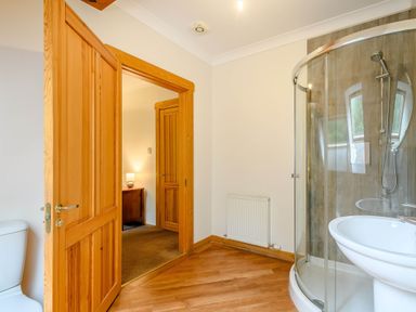 A bathroom with a shower and sink at Eagle Spa Plus in Dundee