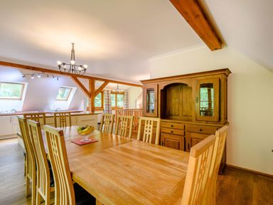 A dining room with a table and chairs at Eagle Spa Plus (Pet) Dundee