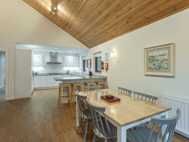 A kitchen with a dining table and chairs at Galbraith Premier Spa (Pet) Dundee