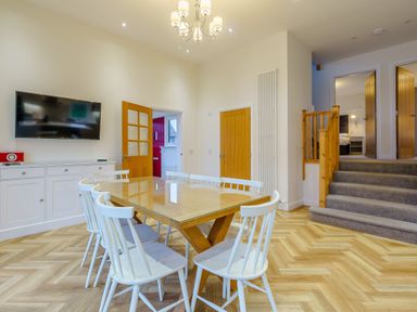 A dining room with a table and chairs at Lochside Premier Spa (Pet) in Dundee