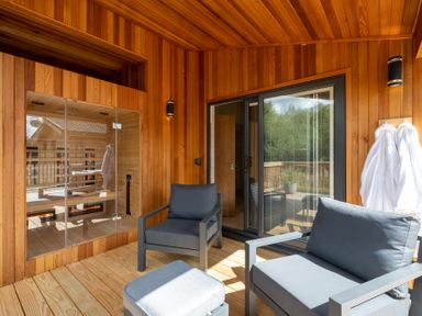 An outdoor lounge area with seating and a sauna at Moonlight Spa Luxury in Waltham