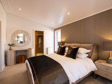 A bedroom with a bed and dresser at Moonlight Spa Luxury in Waltham