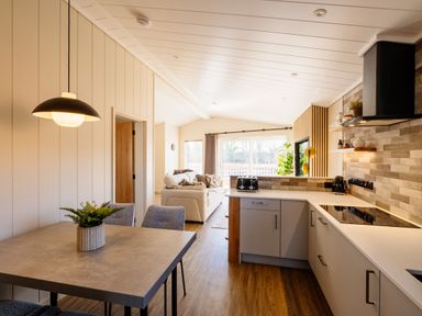 A kitchen with table and chairs at Luxury One Bedroom Retreat in Waltham