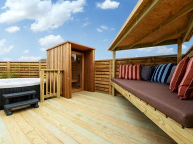 An outdoor area with a hot tub and sauna at Luxury One Bedroom Retreat in Waltham