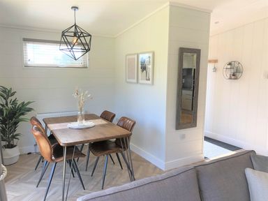 A dining room with a table and chairs at Dream View in Waltham