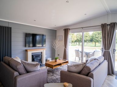A living room with a television and coffee table at Imperial View in Waltham