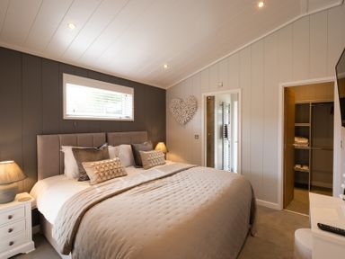 A bedroom with a bed and closet at The Luxury Hideaway in Waltham