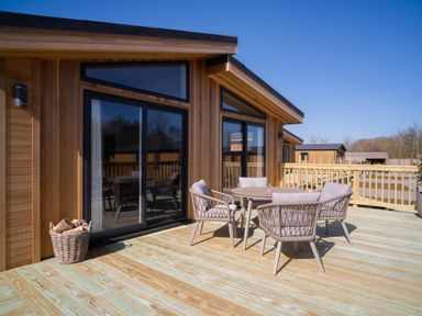 An outdoor area with a table and chairs at Luxurious Serenity in Waltham