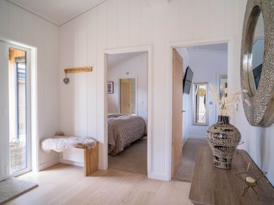 An entrance hall with a bench and coat hook at The Luxury Escape in Waltham