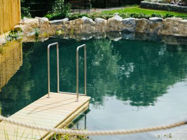 A pool with a deck and handrail at The Royal in Waltham